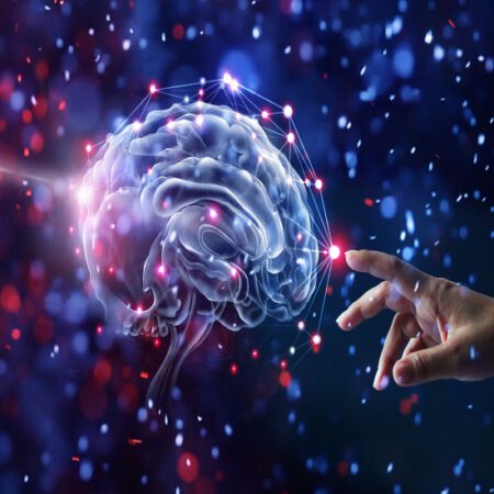 Hand touching brain and network connection on glitter bright lights colorful  background